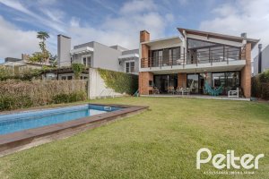 Casa em Condomínio à venda com 336m², 4 dormitórios, 4 suítes, 4 vagas, no bairro Terra Ville em PORTO ALEGRE