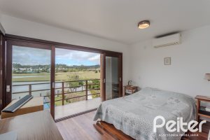 Casa em Condomínio à venda com 336m², 4 dormitórios, 4 suítes, 4 vagas, no bairro Terra Ville em PORTO ALEGRE