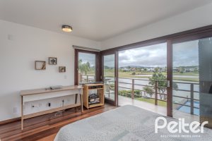 Casa em Condomínio à venda com 336m², 4 dormitórios, 4 suítes, 4 vagas, no bairro Terra Ville em PORTO ALEGRE