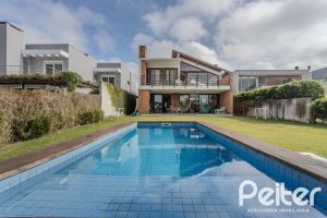 Casa em Condomínio à venda com 336m², 4 dormitórios, 4 suítes, 4 vagas, no bairro Terra Ville em PORTO ALEGRE
