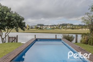 Casa em Condomínio à venda com 336m², 4 dormitórios, 4 suítes, 4 vagas, no bairro Terra Ville em PORTO ALEGRE