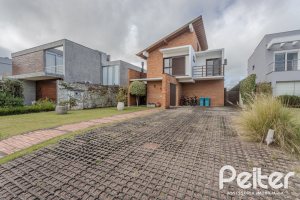 Casa em Condomínio à venda com 336m², 4 dormitórios, 4 suítes, 4 vagas, no bairro Terra Ville em PORTO ALEGRE