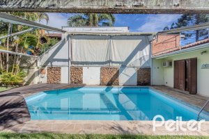 Casa à venda com 223m², 3 dormitórios, 1 suíte, 4 vagas, no bairro Jardim Isabel em Porto Alegre