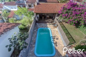 Casa à venda com 227m², 3 dormitórios, 3 suítes, 2 vagas, no bairro Espírito Santo em Porto Alegre