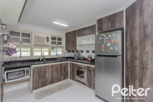 Casa em Condomínio à venda com 201m², 3 dormitórios, 1 suíte, 2 vagas, no bairro Tristeza em PORTO ALEGRE