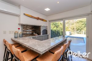 Casa em Condomínio à venda com 216m², 3 dormitórios, 1 suíte, 6 vagas, no bairro Terra Ville em PORTO ALEGRE
