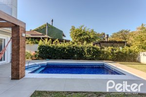 Casa em Condomínio à venda com 216m², 3 dormitórios, 1 suíte, 6 vagas, no bairro Terra Ville em PORTO ALEGRE