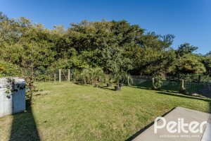 Casa em Condomínio à venda com 216m², 3 dormitórios, 1 suíte, 6 vagas, no bairro Terra Ville em PORTO ALEGRE