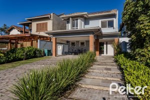 Casa em Condomínio à venda com 216m², 3 dormitórios, 1 suíte, 6 vagas, no bairro Terra Ville em PORTO ALEGRE