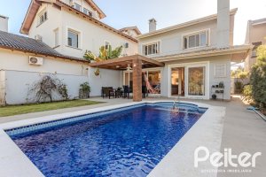 Casa em Condomínio à venda com 216m², 3 dormitórios, 1 suíte, 6 vagas, no bairro Terra Ville em PORTO ALEGRE