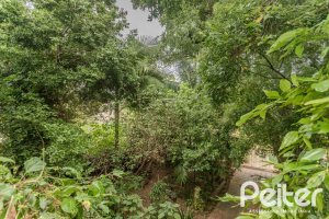 Casa à venda com 234m², 3 dormitórios, 1 suíte, 3 vagas, no bairro Guarujá em Porto Alegre