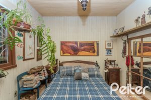Casa à venda com 234m², 3 dormitórios, 1 suíte, 3 vagas, no bairro Guarujá em Porto Alegre