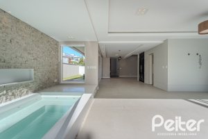 Casa em Condomínio à venda com 400m², 4 dormitórios, 4 suítes, 4 vagas, no bairro Alphaville em PORTO ALEGRE