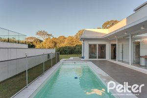 Casa em Condomínio à venda com 206m², 3 dormitórios, 3 suítes, 7 vagas, no bairro Alphaville em PORTO ALEGRE