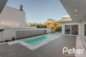 Casa em Condomínio à venda com 206m², 3 dormitórios, 3 suítes, 7 vagas, no bairro Alphaville em PORTO ALEGRE