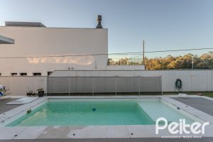 Casa em Condomínio à venda com 206m², 3 dormitórios, 3 suítes, 7 vagas, no bairro Alphaville em PORTO ALEGRE