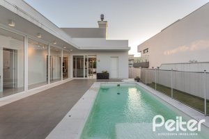 Casa em Condomínio à venda com 206m², 3 dormitórios, 3 suítes, 7 vagas, no bairro Alphaville em PORTO ALEGRE