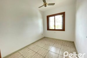 Casa em Condomínio à venda com 97m², 3 dormitórios, 1 suíte, 2 vagas, no bairro Guarujá em Porto Alegre