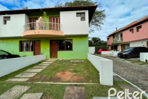 Casa em Condomínio à venda com 97m², 3 dormitórios, 1 suíte, 2 vagas, no bairro Guarujá em Porto Alegre