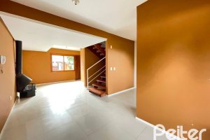 Casa em Condomínio à venda com 97m², 3 dormitórios, 1 suíte, 2 vagas, no bairro Guarujá em Porto Alegre