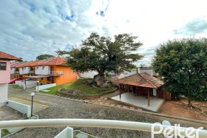 Casa em Condomínio à venda com 97m², 3 dormitórios, 1 suíte, 2 vagas, no bairro Guarujá em Porto Alegre