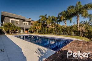 Casa em Condomínio à venda com 361m², 3 dormitórios, 3 suítes, no bairro Terra Ville em PORTO ALEGRE