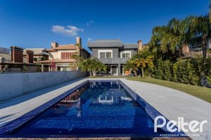 Casa em Condomínio à venda com 361m², 3 dormitórios, 3 suítes, no bairro Terra Ville em PORTO ALEGRE