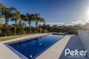 Casa em Condomínio à venda com 361m², 3 dormitórios, 3 suítes, no bairro Terra Ville em PORTO ALEGRE