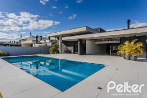 Casa em Condomínio à venda com 392m², 4 dormitórios, 4 suítes, 4 vagas, no bairro Terra Ville em PORTO ALEGRE