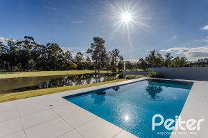 Casa em Condomínio à venda com 392m², 4 dormitórios, 4 suítes, 4 vagas, no bairro Terra Ville em PORTO ALEGRE