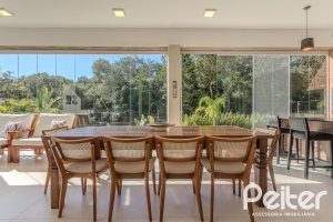 Casa em Condomínio à venda com 340m², 3 dormitórios, 3 suítes, 4 vagas, no bairro Alphaville em PORTO ALEGRE