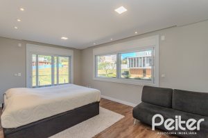 Casa em Condomínio à venda com 340m², 3 dormitórios, 3 suítes, 4 vagas, no bairro Alphaville em PORTO ALEGRE