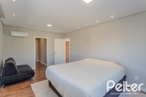 Casa em Condomínio à venda com 340m², 3 dormitórios, 3 suítes, 4 vagas, no bairro Alphaville em PORTO ALEGRE