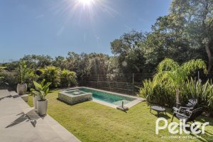 Casa em Condomínio à venda com 340m², 3 dormitórios, 3 suítes, 4 vagas, no bairro Alphaville em PORTO ALEGRE