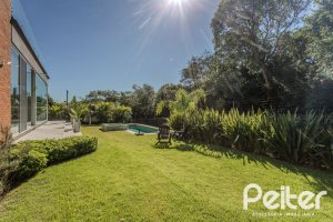 Casa em Condomínio à venda com 340m², 3 dormitórios, 3 suítes, 4 vagas, no bairro Alphaville em PORTO ALEGRE