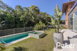 Casa em Condomínio à venda com 340m², 3 dormitórios, 3 suítes, 4 vagas, no bairro Alphaville em PORTO ALEGRE