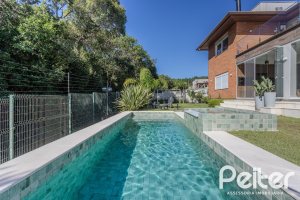 Casa em Condomínio à venda com 340m², 3 dormitórios, 3 suítes, 4 vagas, no bairro Alphaville em PORTO ALEGRE