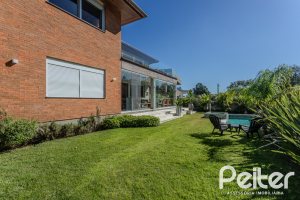 Casa em Condomínio à venda com 340m², 3 dormitórios, 3 suítes, 4 vagas, no bairro Alphaville em PORTO ALEGRE