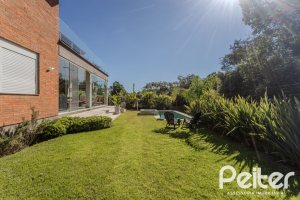Casa em Condomínio à venda com 340m², 3 dormitórios, 3 suítes, 4 vagas, no bairro Alphaville em PORTO ALEGRE