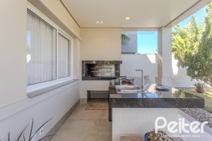 Casa em Condomínio à venda com 441m², 4 dormitórios, 4 suítes, 3 vagas, no bairro Alphaville em PORTO ALEGRE