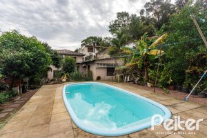 Casa à venda com 338m², 4 dormitórios, 1 suíte, 2 vagas, no bairro Vila Conceição em Porto Alegre