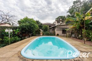 Casa à venda com 338m², 4 dormitórios, 1 suíte, 2 vagas, no bairro Vila Conceição em Porto Alegre