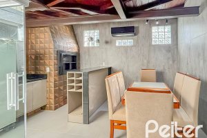 Casa em Condomínio à venda com 117m², 3 dormitórios, 1 suíte, 2 vagas, no bairro Vila Nova em PORTO ALEGRE