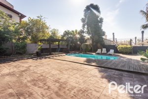 Casa em Condomínio à venda com 328m², 3 dormitórios, 2 suítes, 4 vagas, no bairro Cavalhada em PORTO ALEGRE