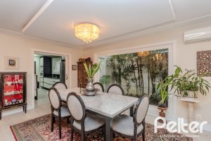 Casa em Condomínio à venda com 296m², 3 dormitórios, 1 suíte, 4 vagas, no bairro Terra Ville em PORTO ALEGRE