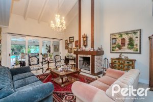 Casa em Condomínio à venda com 296m², 3 dormitórios, 1 suíte, 4 vagas, no bairro Terra Ville em PORTO ALEGRE
