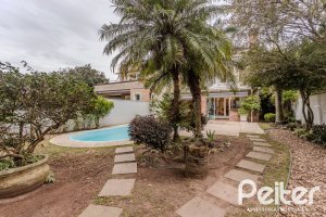 Casa em Condomínio à venda com 296m², 3 dormitórios, 1 suíte, 4 vagas, no bairro Terra Ville em PORTO ALEGRE