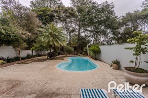 Casa em Condomínio à venda com 296m², 3 dormitórios, 1 suíte, 4 vagas, no bairro Terra Ville em PORTO ALEGRE