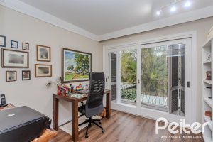 Casa em Condomínio à venda com 296m², 3 dormitórios, 1 suíte, 4 vagas, no bairro Terra Ville em PORTO ALEGRE