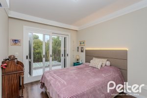 Casa em Condomínio à venda com 296m², 3 dormitórios, 1 suíte, 4 vagas, no bairro Terra Ville em PORTO ALEGRE